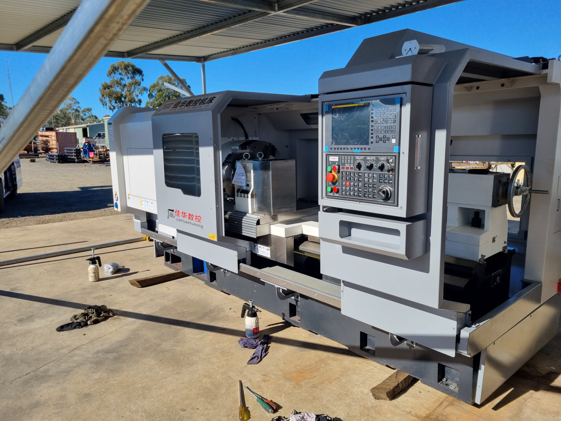 CNC lathe set up under cover in the Allegiant workshop yard